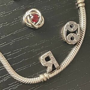 Pandora silver bracelet and 3 charms